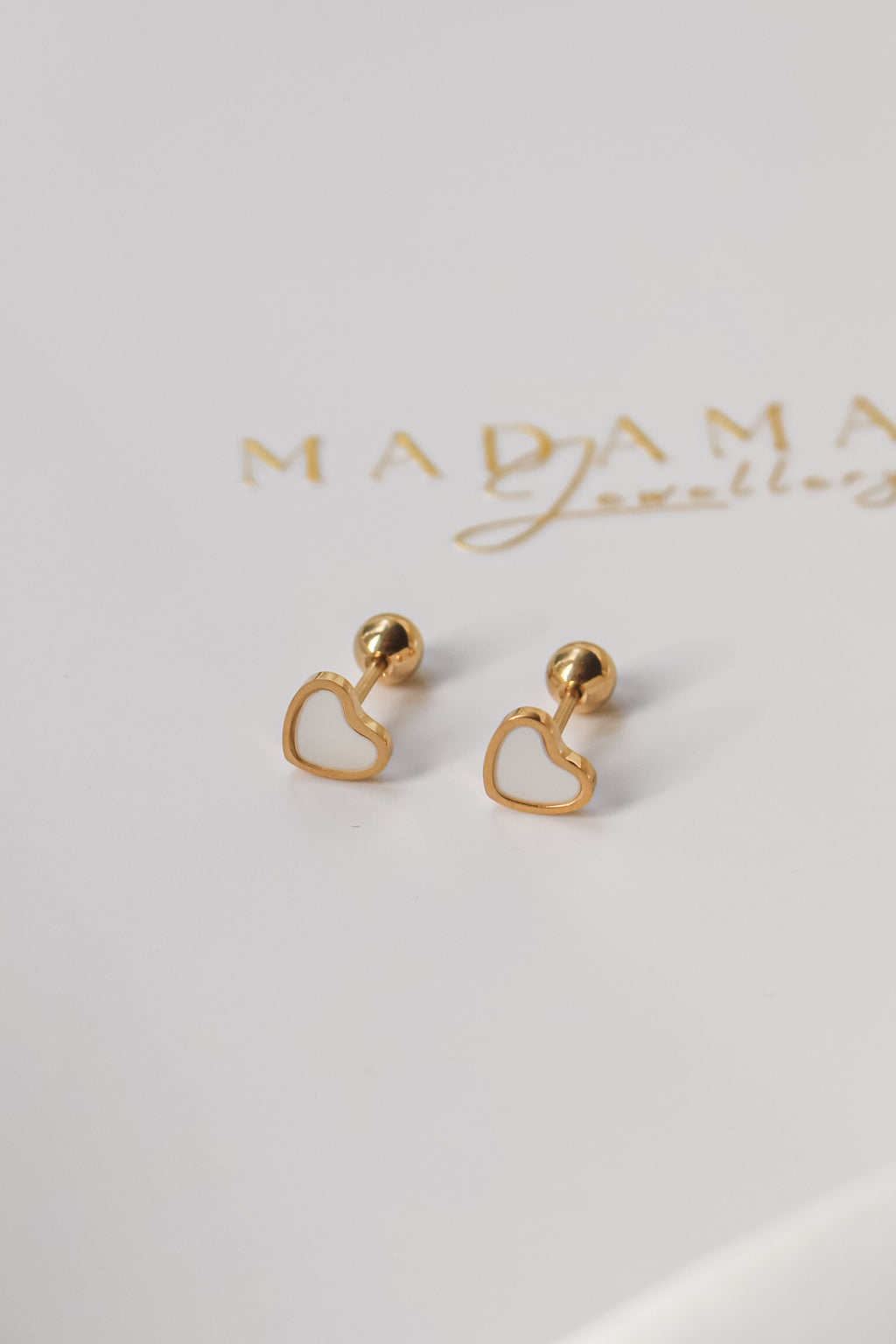 LOVE | Cream screw earrings