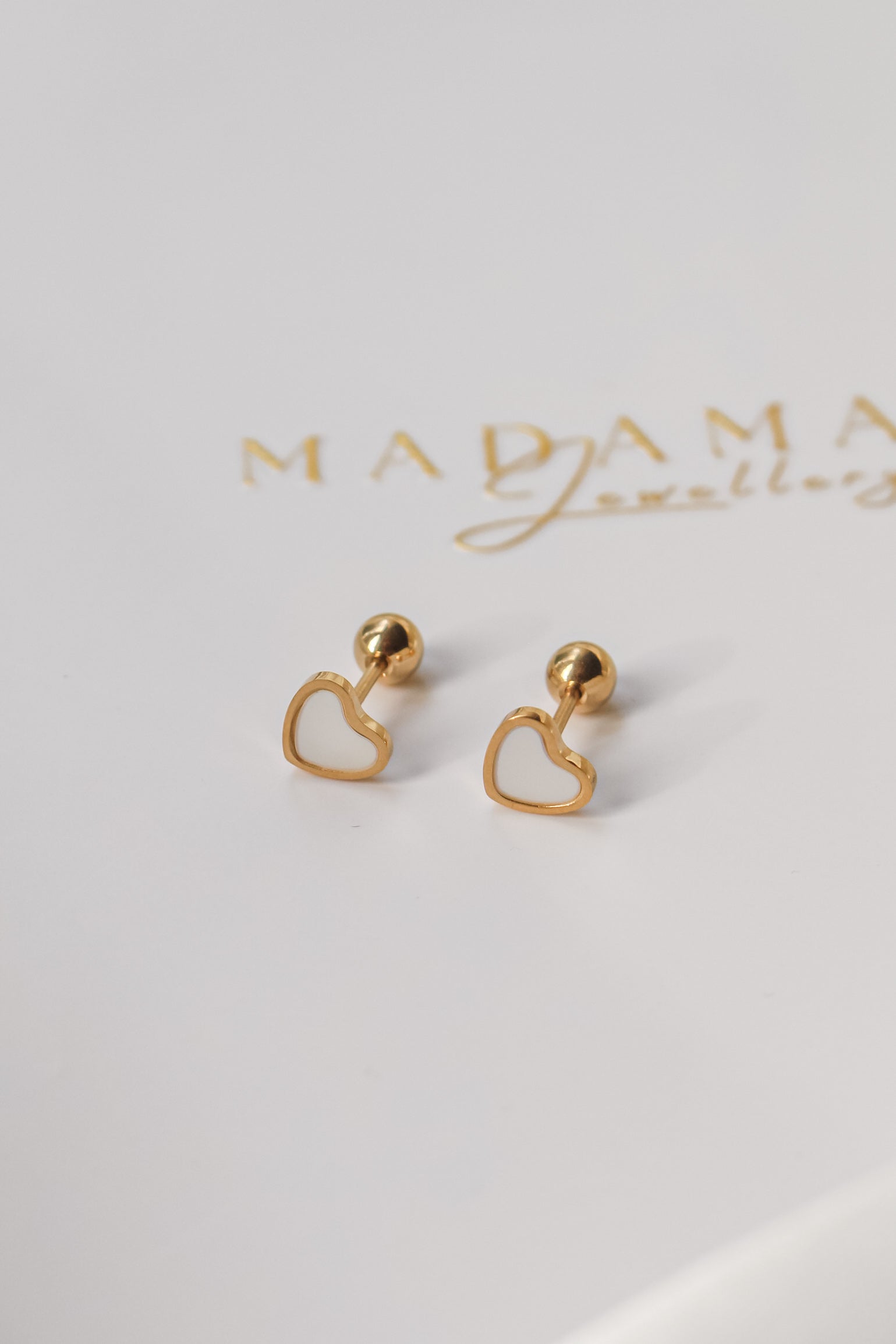 LOVE | Cream screw earrings