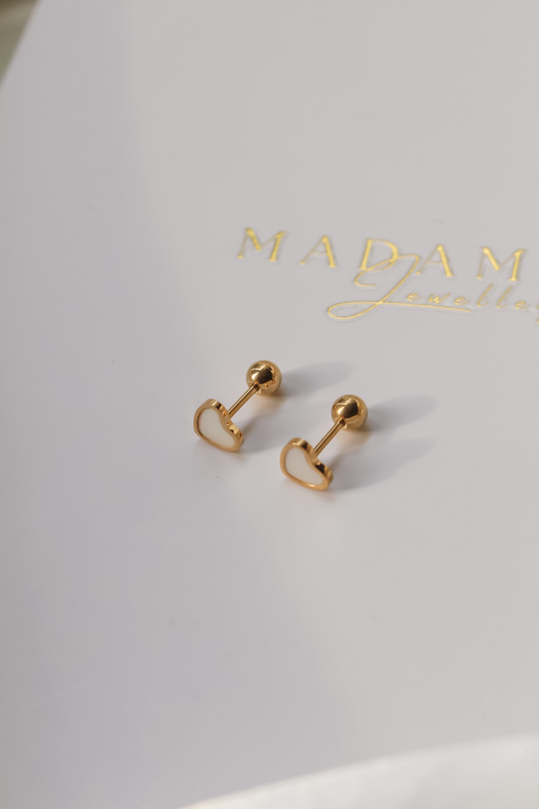 LOVE | Cream screw earrings
